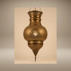 Large handcrafted Moorish brass lantern featuring intricate hand-pierced filigree work, casting mesmerizing geometric light patterns on the ceiling at the Sahara Import gallery in Oakland.